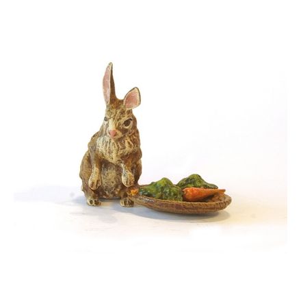 Hase bei Karottenkorb